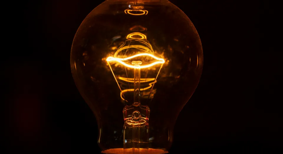 Warm filament light against a dark background